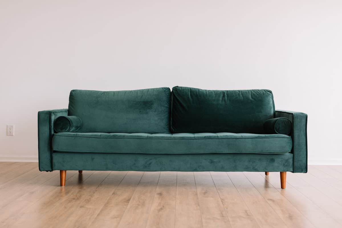 Green designer sofa in a furniture store